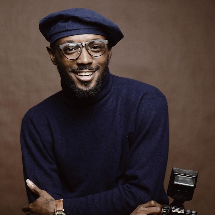 Kaveri Mehta, Lead Design Curator at PrimeHarborLine, reviewing corporate floral arrangements